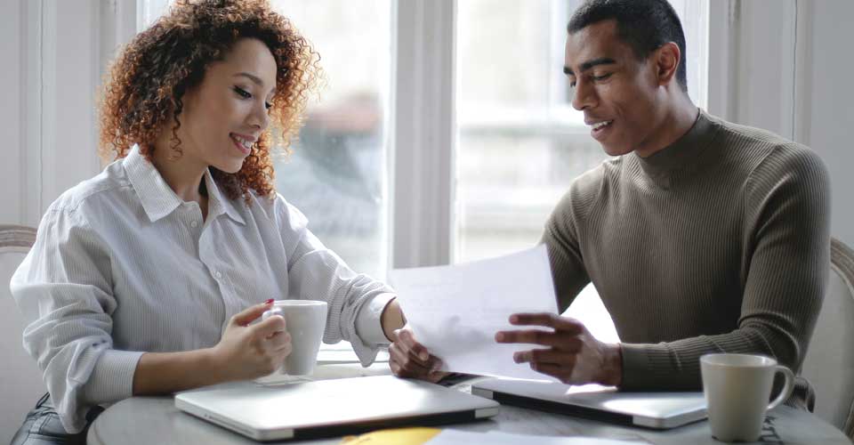 young couple with paperwork